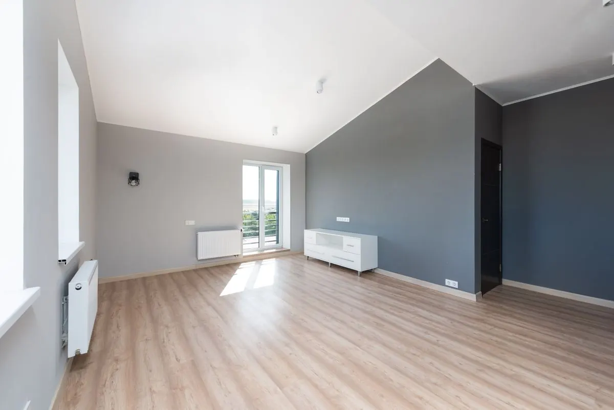 Clean, empty apartment interior used as an illustrative restored-space example